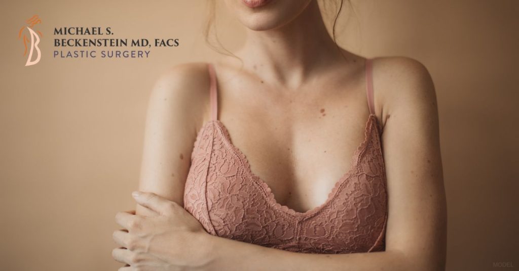 Woman wearing a nude bralette (model)